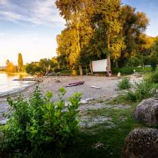 by the water