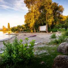 by the water
